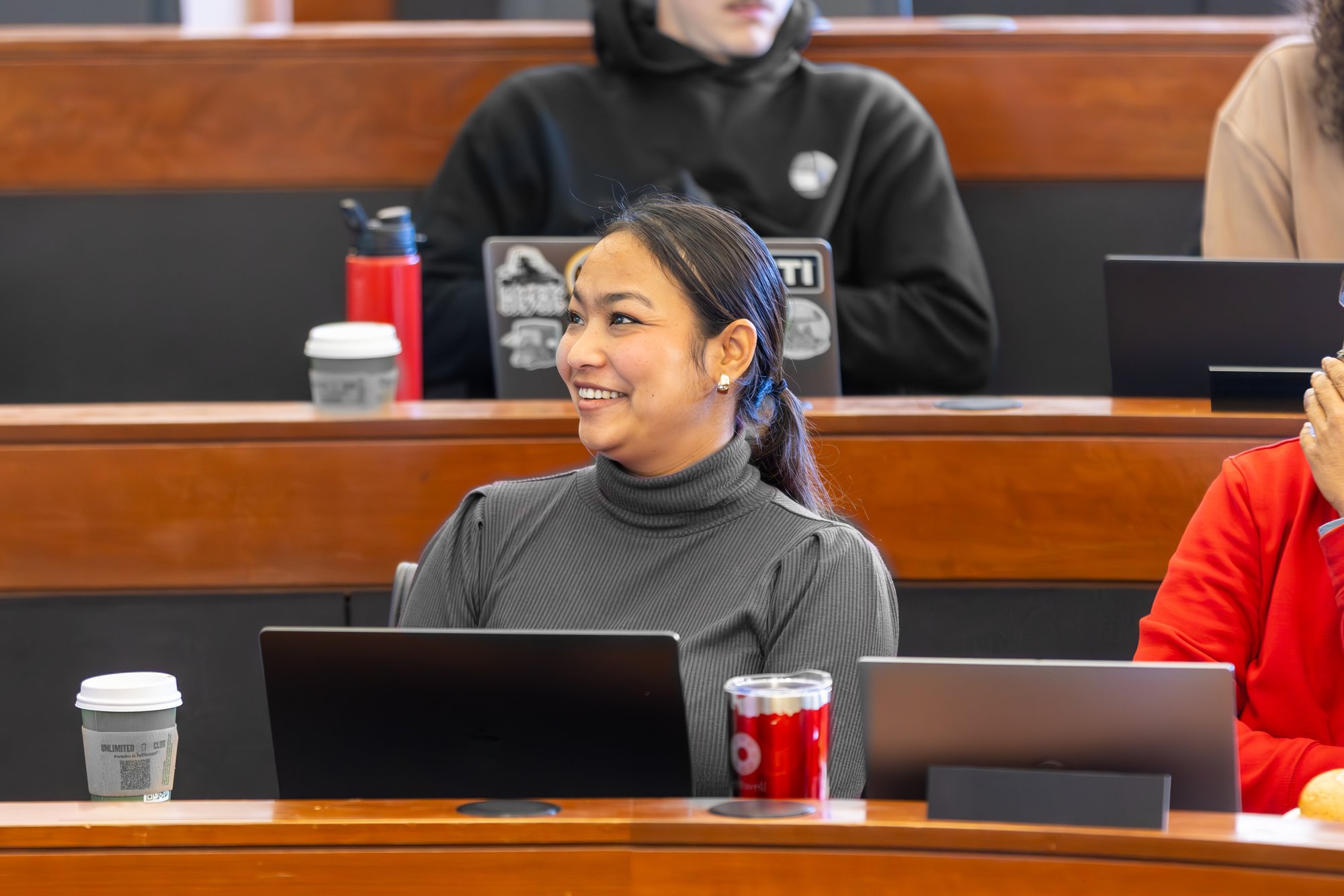 Female-student-smiling-in-class